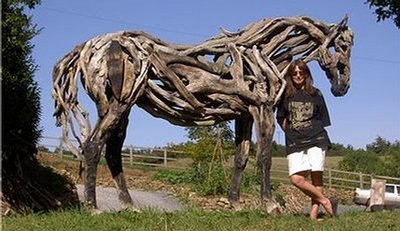 Sculptor Heather Jansch with driftwood horse “Beltane Juno” Photo by Julian Hanbury